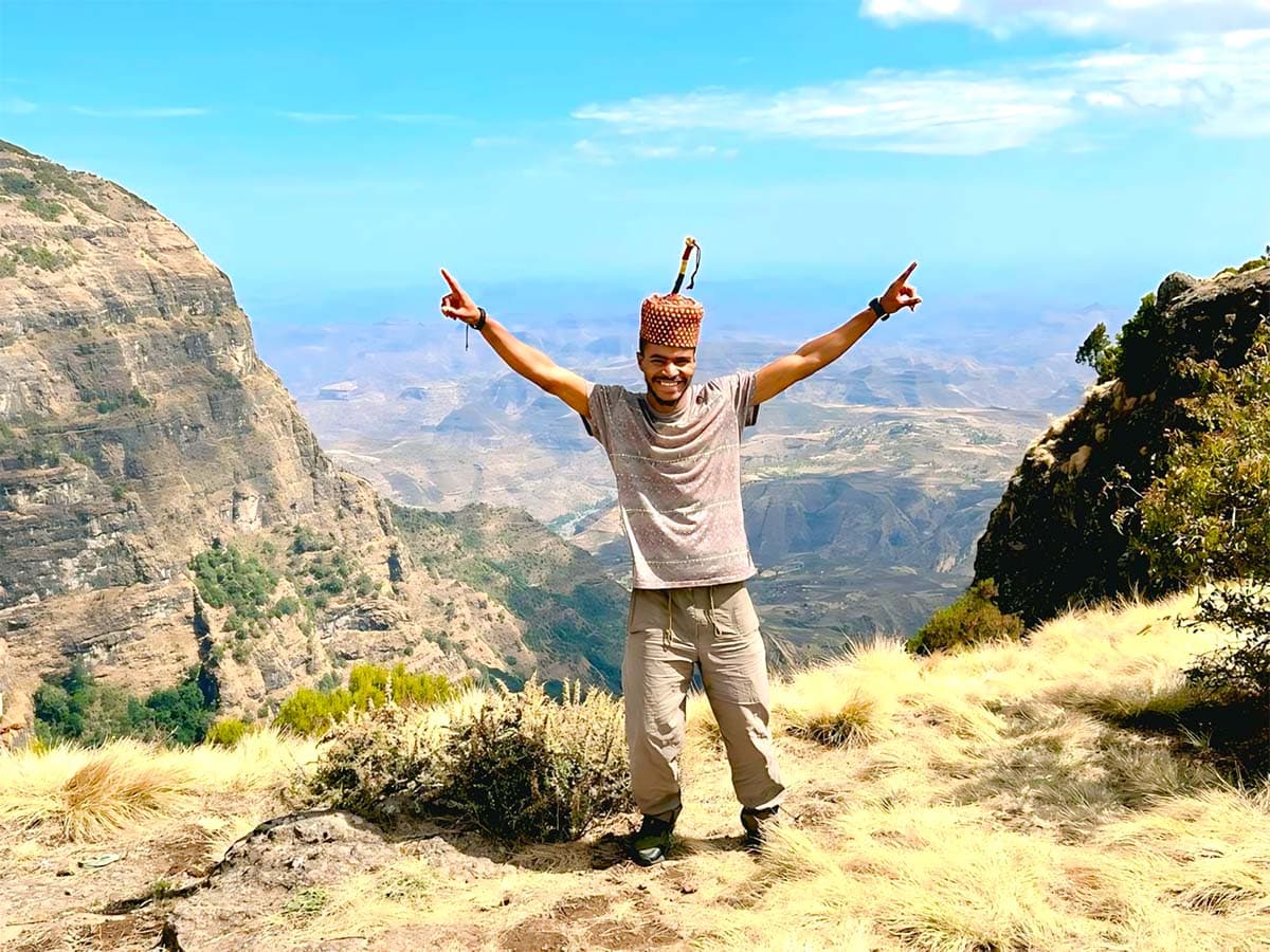 Tesema ‘Tevan’ Mulualem standing in the Simien Mountains